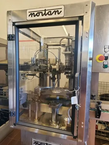 Used Bottling Polylaminate Capsuling Machine Nortan - 1998, 750 BPH