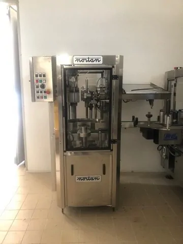 Used Bottling PVC Capsuling Machine Nortan UNICAP 35 T - 2004, 2,500 BPH