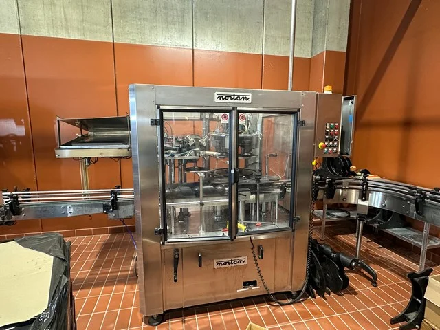 Used Bottling PVC Capsuling Machine Nortan PRISMA 4+4 TR - 2002, 3,000 BPH