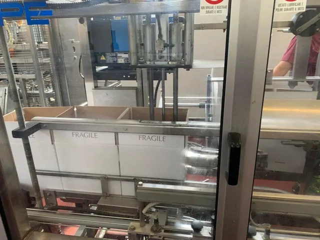 Used Bottling Case Erector APE form 1200 hm - 1994, 900 BPH