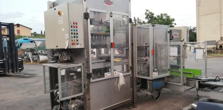 Used Bottling Case Packing Monoblock OMA CFS 600 HM - 2007, 13 CPM